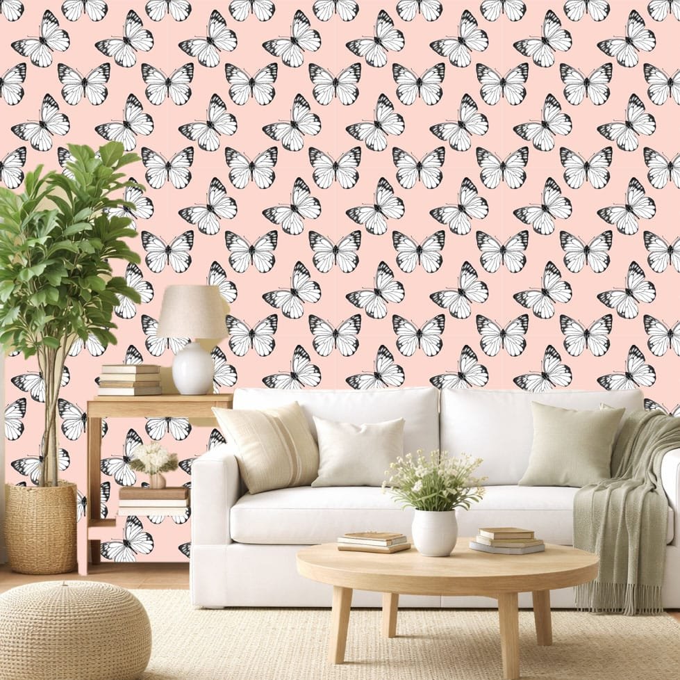 Butterfly Breeze wallpaper zoomed-in with black and white butterflies on a soft blush pink background.