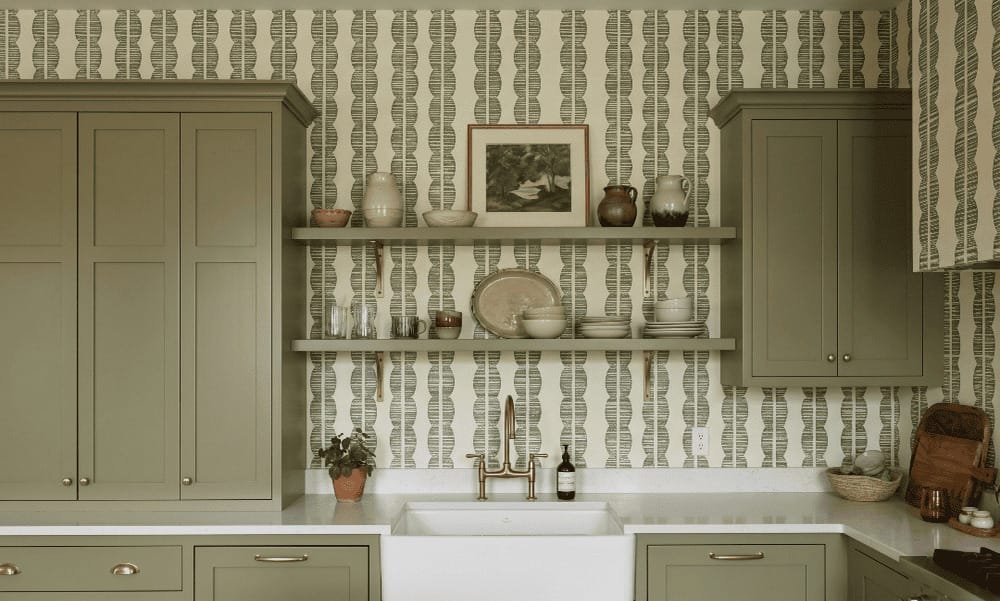 A zoomed-in of Sage Totem wallpaper highlighting textured olive geometric stripes and organic stacked motifs