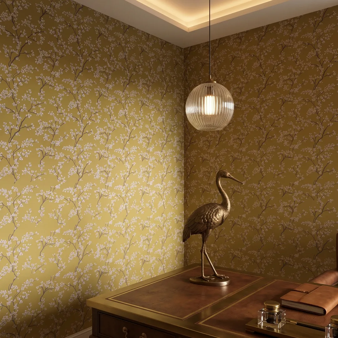 A zoomed-in of White blossom wallpaper in an ochre home office.